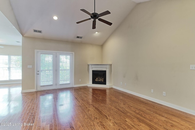 14518 Lake Village Dr Unit 4B, Louisville, KY 40299 - unfurnished living room with ceiling fan, wood finished floors, high vaulted ceiling, a fireplace with raised hearth, and recessed lighting