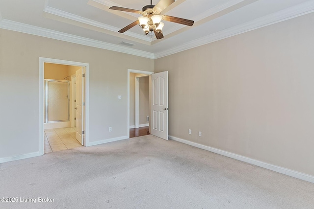 14518 Lake Village Dr Unit 4B, Louisville, KY 40299 - unfurnished bedroom featuring light colored carpet, a raised ceiling, ornamental molding, a ceiling fan, and ensuite bathroom