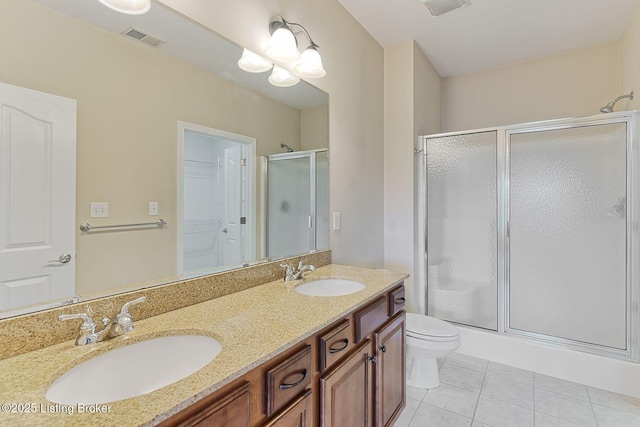 14518 Lake Village Dr Unit 4B, Louisville, KY 40299 - full bathroom featuring a shower stall, tile patterned floors, double vanity, and a walk in closet
