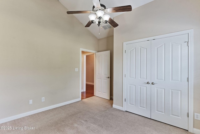 14518 Lake Village Dr Unit 4B, Louisville, KY 40299 - unfurnished bedroom featuring light colored carpet, a closet, vaulted ceiling, and ceiling fan