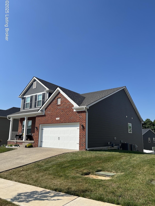 11922 Cascade Falls Trl, Louisville, KY 40229 - view of front facade featuring a garage, a front lawn, concrete driveway, and brick siding