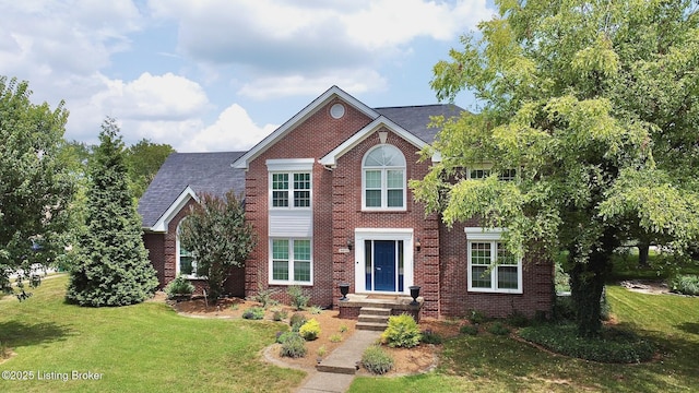 4201 Patterson Park Ct, Louisville, KY 40299 - colonial home featuring a front yard, brick siding, and roof with shingles