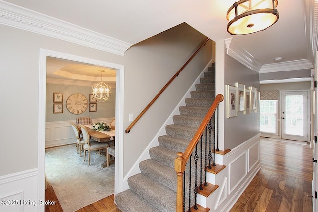 4201 Patterson Park Ct, Louisville, KY 40299 - stairway with crown molding, hardwood / wood-style flooring, wainscoting, a decorative wall, and a tray ceiling