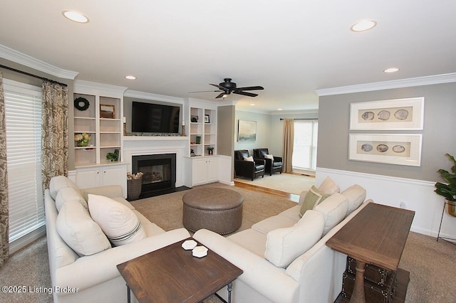 4201 Patterson Park Ct, Louisville, KY 40299 - carpeted living room featuring a fireplace with flush hearth, ornamental molding, a ceiling fan, and recessed lighting