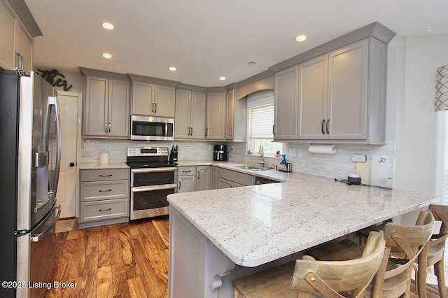 4201 Patterson Park Ct, Louisville, KY 40299 - kitchen with stainless steel appliances, gray cabinetry, a peninsula, and recessed lighting