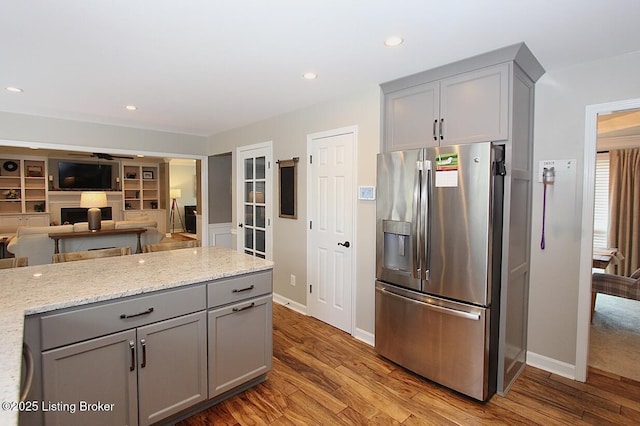 4201 Patterson Park Ct, Louisville, KY 40299 - kitchen featuring stainless steel fridge with ice dispenser, gray cabinets, light wood finished floors, light stone countertops, and recessed lighting