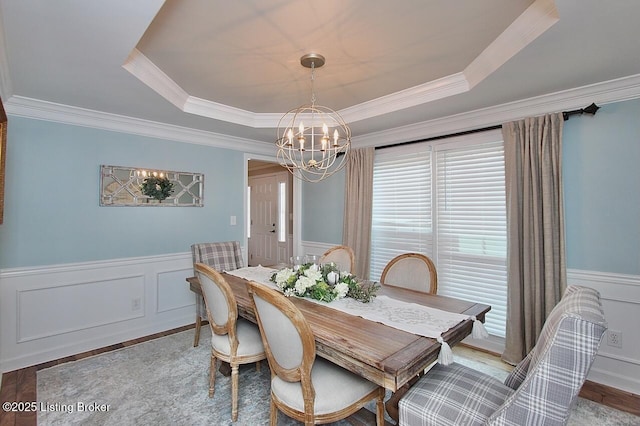 4201 Patterson Park Ct, Louisville, KY 40299 - dining area with a chandelier, a raised ceiling, a wainscoted wall, a decorative wall, and crown molding