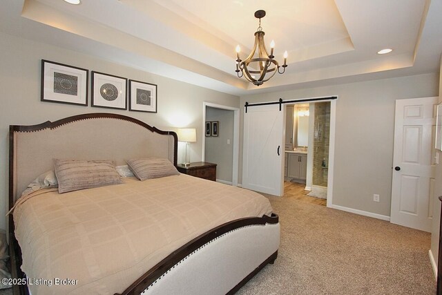 4201 Patterson Park Ct, Louisville, KY 40299 - bedroom with a tray ceiling, a barn door, a chandelier, light carpet, and recessed lighting