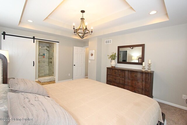 4201 Patterson Park Ct, Louisville, KY 40299 - carpeted bedroom with a tray ceiling, a barn door, a chandelier, recessed lighting, and ensuite bathroom