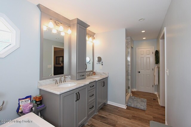 4201 Patterson Park Ct, Louisville, KY 40299 - full bath featuring wood finished floors, double vanity, a stall shower, and recessed lighting
