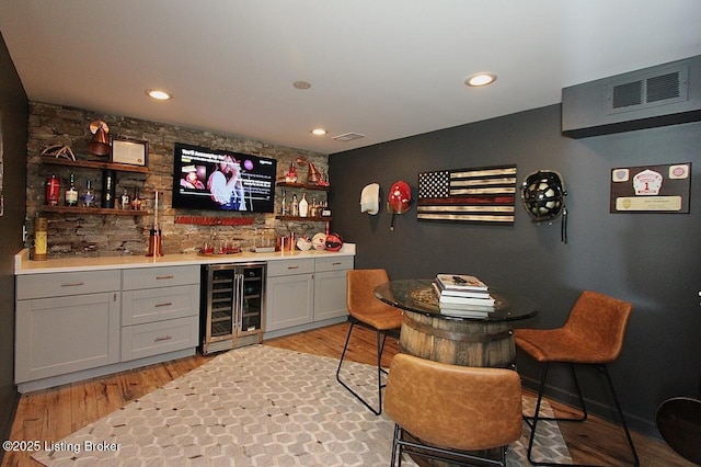 4201 Patterson Park Ct, Louisville, KY 40299 - indoor wet bar featuring beverage cooler, light wood-style floors, and recessed lighting