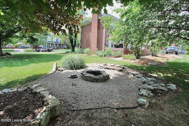 4201 Patterson Park Ct, Louisville, KY 40299 - view of green lawn featuring an outdoor fire pit