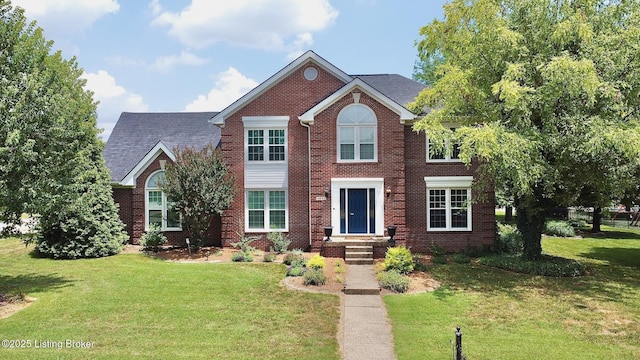 4201 Patterson Park Ct, Louisville, KY 40299 - colonial-style house featuring a front yard and brick siding