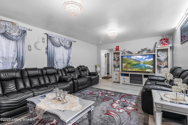 6206 Tabor Dr, Louisville, KY 40218 - living area with wood finished floors and a chandelier