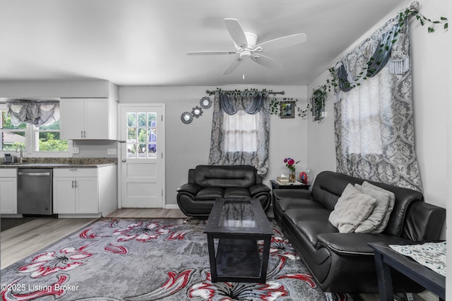 6206 Tabor Dr, Louisville, KY 40218 - living area with a ceiling fan and light wood-style floors