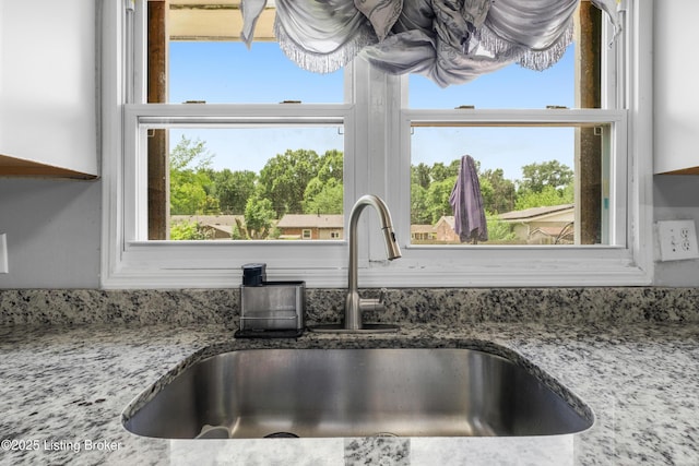 6206 Tabor Dr, Louisville, KY 40218 - kitchen view of a sink and stone countertops