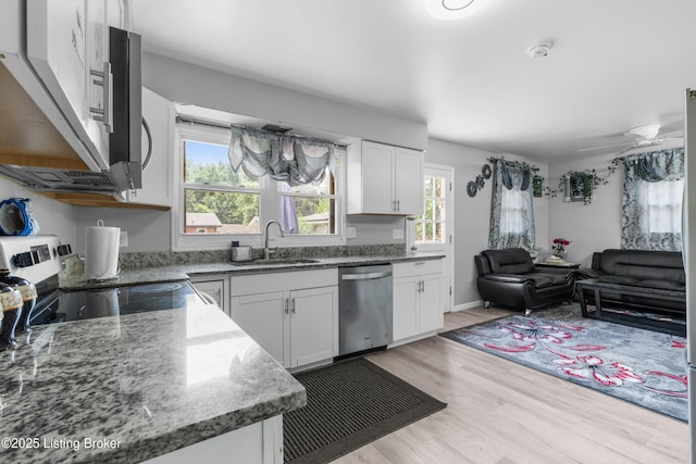 6206 Tabor Dr, Louisville, KY 40218 - kitchen with stainless steel appliances, open floor plan, healthy amount of natural light, and white cabinetry