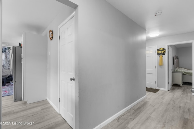 6206 Tabor Dr, Louisville, KY 40218 - hallway with light wood-style flooring and baseboards