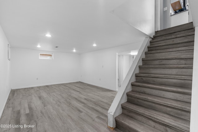 6206 Tabor Dr, Louisville, KY 40218 - below grade area featuring stairs, recessed lighting, and wood finished floors