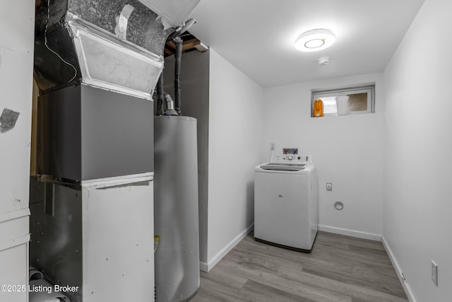 6206 Tabor Dr, Louisville, KY 40218 - laundry area with washer / clothes dryer, gas water heater, heating unit, and wood finished floors