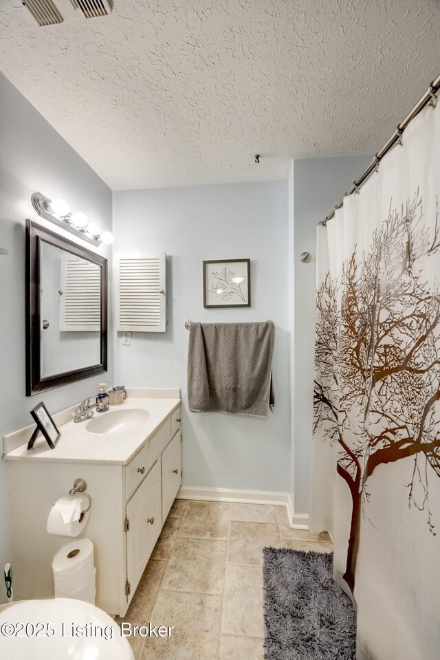 9315 Loch Lea Ln Unit B, Louisville, KY 40291 - full bathroom featuring vanity, a textured ceiling, tile patterned floors, and curtained shower