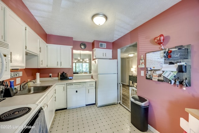 9315 Loch Lea Ln Unit B, Louisville, KY 40291 - kitchen with white appliances, white cabinets, light countertops, a textured ceiling, and light flooring