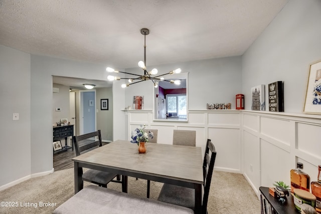 9315 Loch Lea Ln Unit B, Louisville, KY 40291 - dining room with a chandelier, light carpet, wainscoting, and a textured ceiling