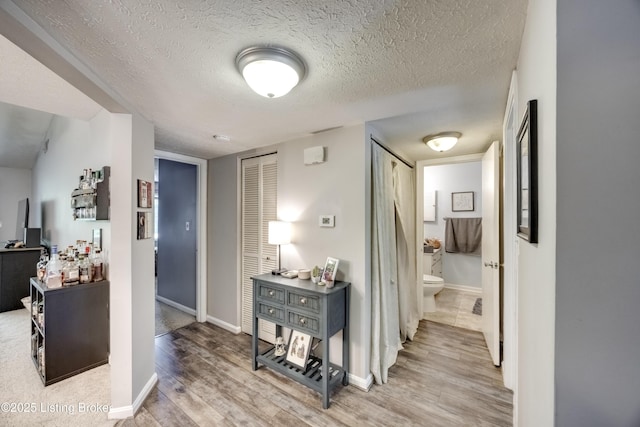 9315 Loch Lea Ln Unit B, Louisville, KY 40291 - hallway featuring wood finished floors and a textured ceiling