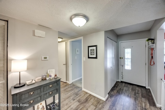 9315 Loch Lea Ln Unit B, Louisville, KY 40291 - foyer entrance featuring wood finished floors and a textured ceiling