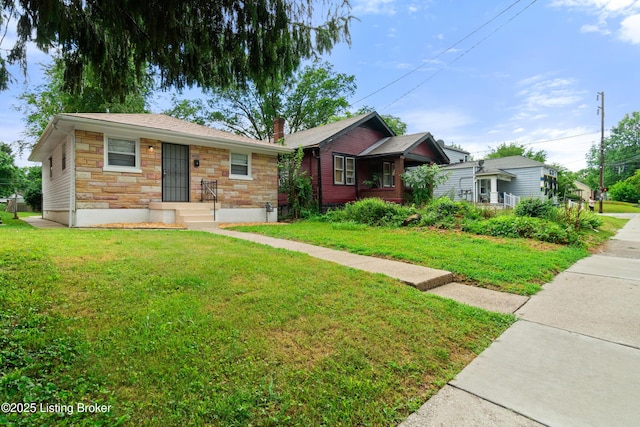 3322 Virginia Ave, Louisville, KY 40211 - view of front of property featuring stone siding, a front yard, and a chimney