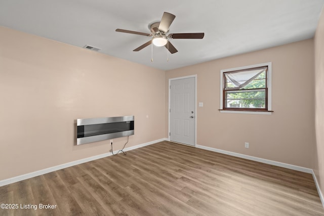 3322 Virginia Ave, Louisville, KY 40211 - unfurnished living room with wood finished floors and a ceiling fan