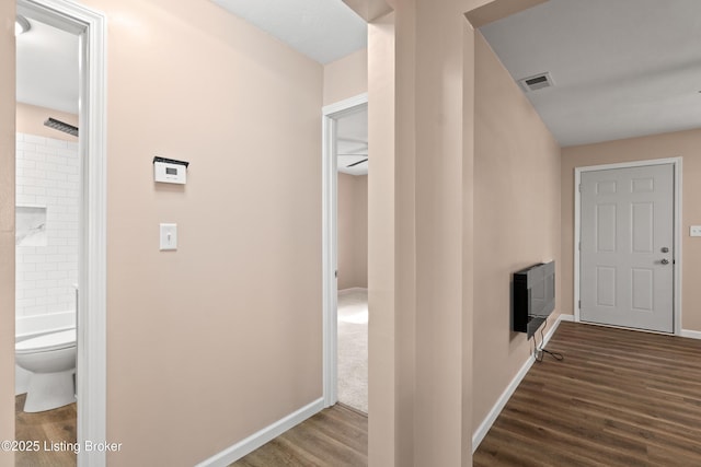 3322 Virginia Ave, Louisville, KY 40211 - corridor featuring dark wood-style floors and heating unit