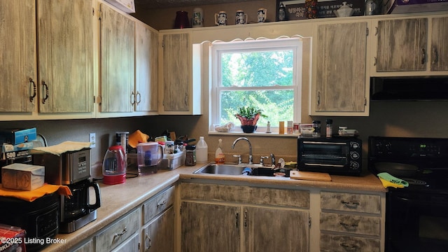 609 E Main St, Vine Grove, KY 40175 - kitchen featuring black electric range oven, extractor fan, and light countertops