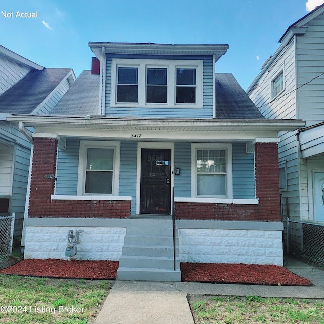 1412 Beech St, Louisville, KY 40211 - bungalow-style house featuring covered porch, brick siding, and roof with shingles