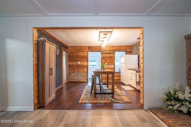 650 Midway Rd, Guston, KY 40142 - dining room featuring dark wood-style floors and wood walls
