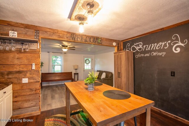 650 Midway Rd, Guston, KY 40142 - dining space with dark wood finished floors, a ceiling fan, and a textured ceiling