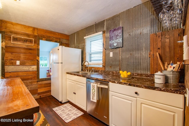 650 Midway Rd, Guston, KY 40142 - kitchen with dishwasher, freestanding refrigerator, wooden walls, dark wood finished floors, and plenty of natural light