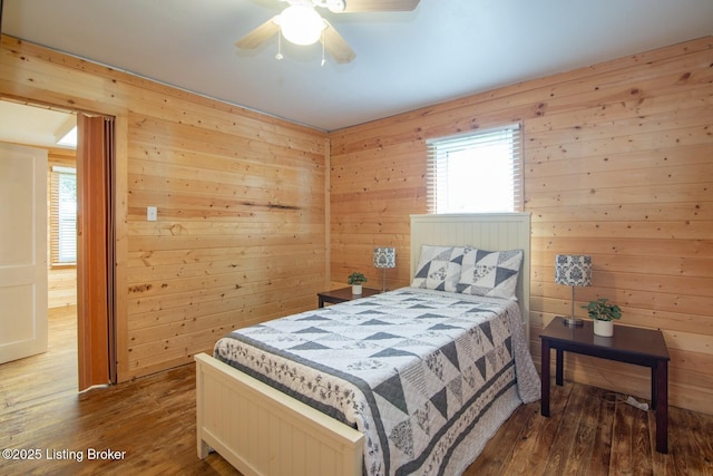 650 Midway Rd, Guston, KY 40142 - bedroom featuring hardwood / wood-style flooring, wooden walls, and a ceiling fan
