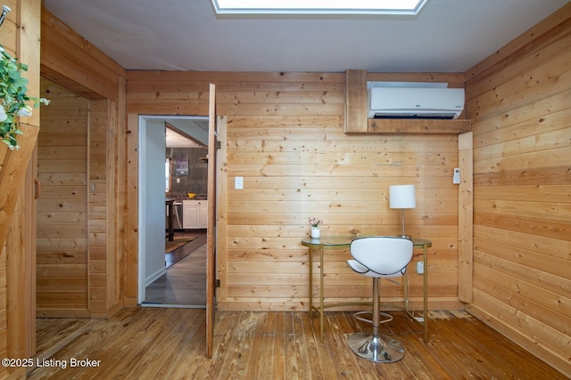 650 Midway Rd, Guston, KY 40142 - bathroom with wooden walls, a wall mounted air conditioner, and hardwood / wood-style floors