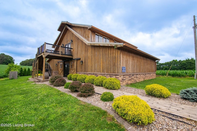 650 Midway Rd, Guston, KY 40142 - view of side of property with a deck, a yard, and stone siding