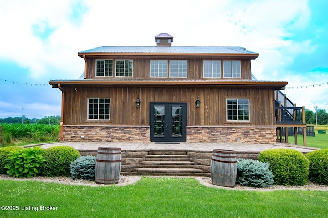 650 Midway Rd, Guston, KY 40142 - back of house with stone siding, french doors, a metal roof, and a lawn