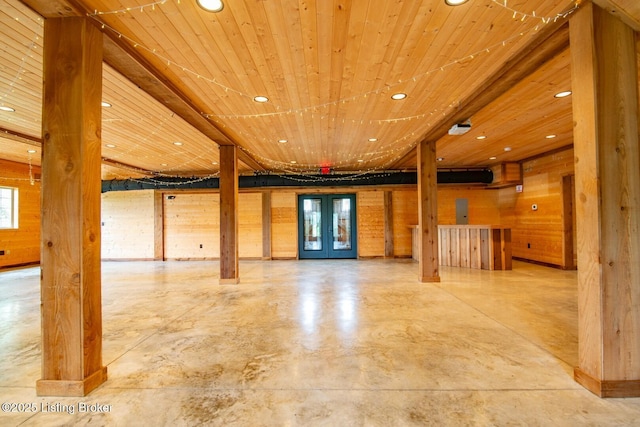650 Midway Rd, Guston, KY 40142 - unfurnished living room with recessed lighting, concrete flooring, wooden ceiling, french doors, and wooden walls