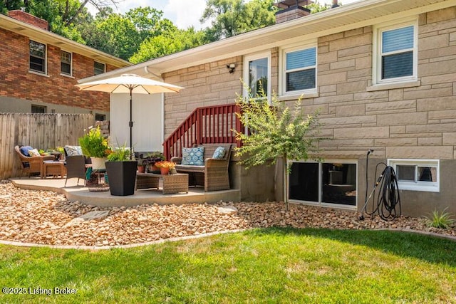 1701 Quarry Hill Rd, Louisville, KY 40213 - back of house featuring an outdoor hangout area, stone siding, a chimney, and a patio