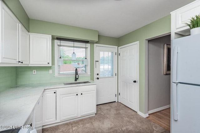 1701 Quarry Hill Rd, Louisville, KY 40213 - kitchen with freestanding refrigerator, white cabinetry, and decorative backsplash