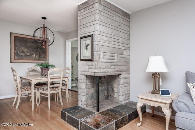 1701 Quarry Hill Rd, Louisville, KY 40213 - living area with wood finished floors, a chandelier, and a fireplace