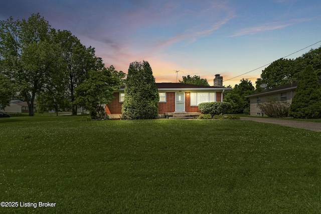 8703 Fernview Dr, Louisville, KY 40291 - view of front of property with brick siding, a chimney, and a front yard