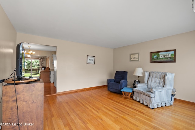 8703 Fernview Dr, Louisville, KY 40291 - living area featuring a chandelier and wood finished floors