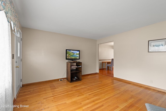 8703 Fernview Dr, Louisville, KY 40291 - unfurnished living room featuring light wood-type flooring and baseboards