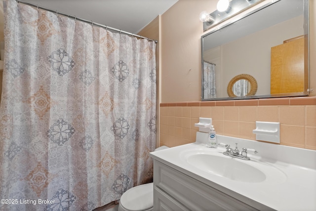 8703 Fernview Dr, Louisville, KY 40291 - bathroom featuring tile walls, vanity, wainscoting, and a shower with curtain