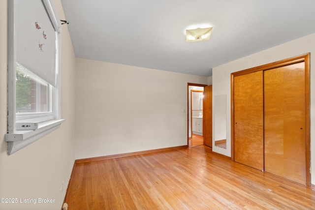 8703 Fernview Dr, Louisville, KY 40291 - unfurnished bedroom featuring light wood-style flooring and a closet